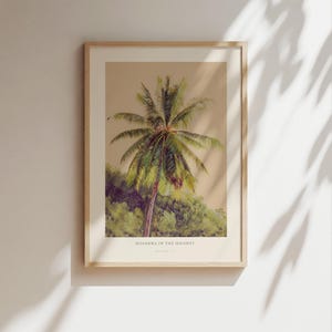 May include: A framed print displaying a palm tree with green leaves and a brown trunk, set against a backdrop of green foliage and a light brown sky. The text "HOSANNA IN THE HIGHEST" is printed at the bottom of the image.