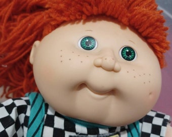 Vintage Cabbage Patch doll Kids first edition Red Hair Green Eyes collectible condition is pre-owned is in good condition but writing on tag