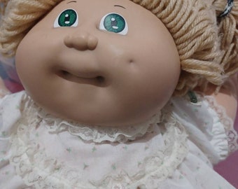 Vintage Cabbage Patch Kid 1985 Coleco Blue Eyed. Condition is pre-owned in good condition but have normal vintage wear  outfit elastic is he