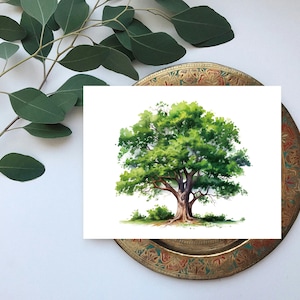 May include: Watercolor painting of a large tree with a full, green canopy and a thick, brown trunk. The artwork is on a white background, set on a decorative, round, gold-toned plate. Eucalyptus branches are in the upper left.