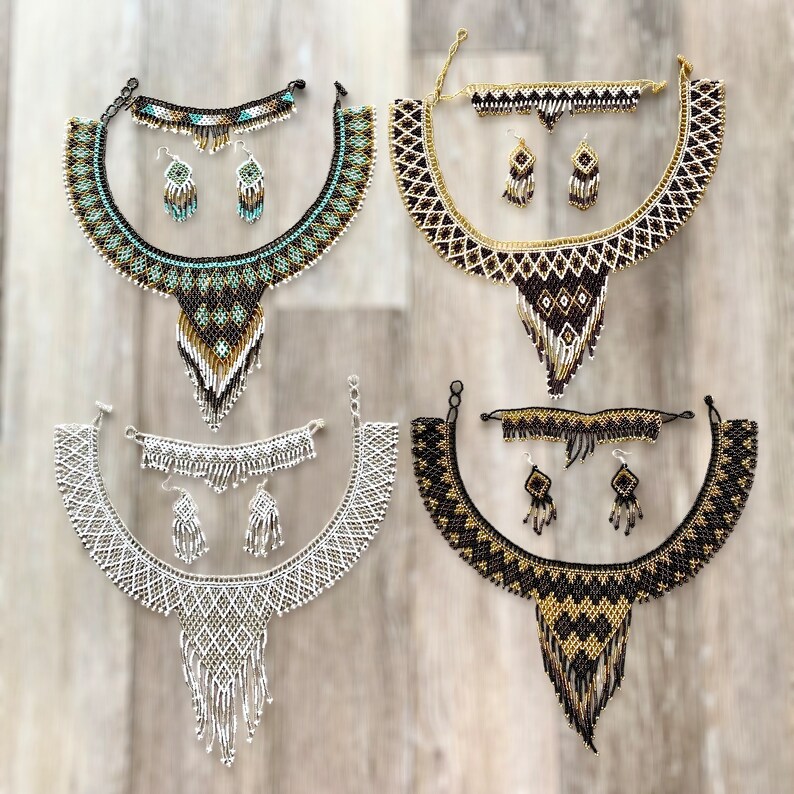 May include: Four beaded jewelry sets, each including a necklace, earrings, and a bracelet. The necklaces are in various colors: turquoise, black, white, and gold. The earrings and bracelets match the necklace colors and patterns.