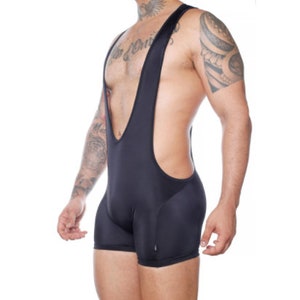 May include: Black wrestling singlet with a high-cut design. The one-piece garment features a scoop neck and shoulder straps. The shorts portion of the singlet is form-fitting. The fabric appears to be a smooth, stretchy material.