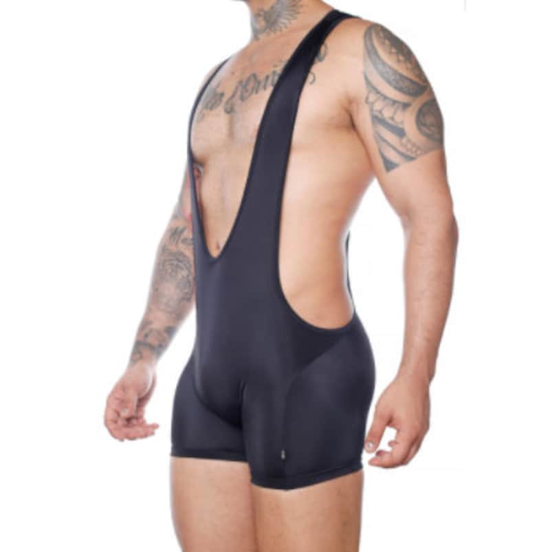 May include: Black wrestling singlet with a high-cut design. The one-piece garment features a scoop neck and shoulder straps. The shorts portion of the singlet is form-fitting. The fabric appears to be a smooth, stretchy material.