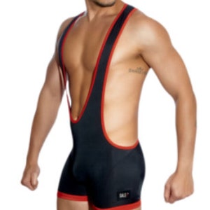 May include: Black wrestling singlet with red trim. The singlet features a scoop neck and a racerback design. The garment has a small logo on the lower left leg. The singlet is made of a stretchy material.