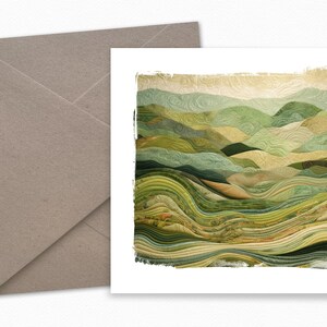 May include: A green and brown abstract landscape art print with a textured, quilted look. The print has a white border and a distressed, faded effect.