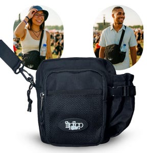 May include: Black crossbody bag with a mesh pocket and a water bottle holder. The bag has a zippered main compartment and a logo on the front. The bag is worn by two people in the image.