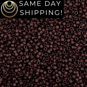 May include: A close-up shot of a large quantity of small, cylindrical, dark brown beads. The beads are densely packed together, filling the frame. The text "SAME DAY SHIPPING!" is displayed in white letters on a black background in the upper portion of the image.