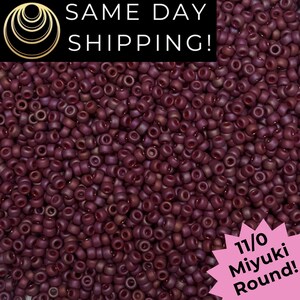 May include: A close-up of a pile of small, round, dark red beads. The beads are labeled as 11/0 Miyuki Round. The image also includes the text "SAME DAY SHIPPING!" in white letters on a black background.