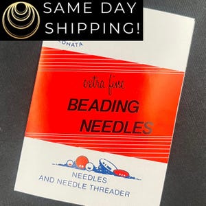 May include: A package of extra fine beading needles with the text "BEADING NEEDLES" in large black letters on a red background. The package also includes the text "NEEDLES AND NEEDLE THREADER".
