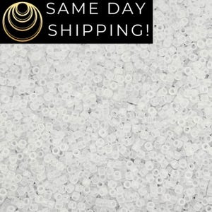 May include: A close-up shot of a large quantity of small, clear, cylindrical beads. The beads are scattered, filling the frame. The text "SAME DAY SHIPPING!" is displayed in a black rectangle at the top of the image.