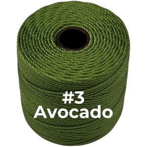 May include: A cylindrical spool of twisted cord in an avocado green color. The spool features a dark center core and has the text #3 Avocado printed in white on the front surface of the cord, indicating the specific color and style of the item.