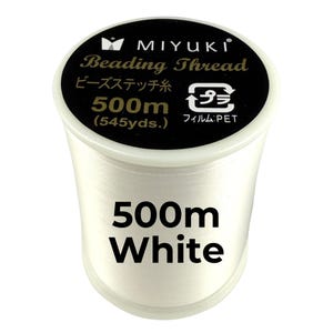 May include: A spool of white Miyuki beading thread. The black top label features the brand name, the text Beading Thread, 500m (545yds.), and a recycling symbol. The side of the spool is clearly labeled with the text 500m White in bold black font.
