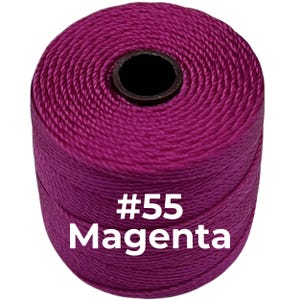 May include: A cylindrical spool of vibrant magenta cord featuring a tightly wound, textured surface. The center of the spool has a dark circular core. The text #55 Magenta is printed in white on the front of the magenta cord spool.