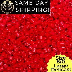 May include: A close-up of a pile of bright red Delica beads, size 8/0. The beads are cylindrical with a hole through the center. The text "SAME DAY SHIPPING!" is at the top. A yellow starburst graphic indicates "Size 8/0 Large Delicas!"