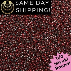 May include: Close-up of a pile of small, round, dark red beads. The beads are labeled as 11/0 Miyuki Round. The image also contains the text "SAME DAY SHIPPING!"
