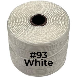 May include: A cylindrical spool of white twisted cord featuring a dark brown center core. The spool is clearly labeled with the black text #93 White printed directly onto the surface of the cord, indicating the specific color and product identifier.