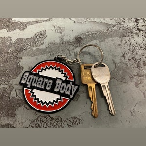 Square Body Round - Metal Keychain Chevy Chevrolet - Stamped Metal Enamel Paint Fill - 2.5 Inches - Oklahoma Customs Original Design