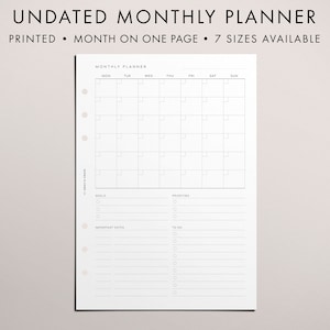 May include: A printable undated monthly planner with a calendar grid, goals, priorities, and to-do lists. The planner is designed for use with a disc-bound system.