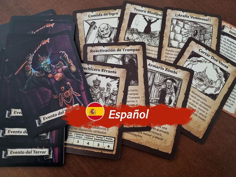 May include: A collection of game cards with illustrations of monsters and characters. The cards are in Spanish and feature titles like "Comida de Ogro" and "Reactivaci&oacute;n de Trampas".
