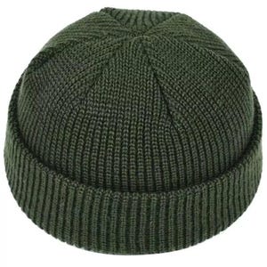 May include: A dark olive green beanie cap featuring a thick, vertical ribbed knit texture. The hat has a rounded crown with a distinct six-point seam construction at the top and a wide, folded cuff that encircles the entire base of the headwear.