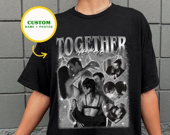 May include: Black t-shirt with a graphic print of a couple in a heart shape with the text "TOGETHER FOREVER".