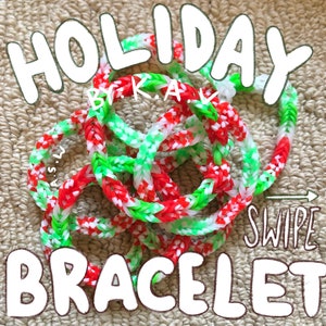 May include: A red, white and green holiday bracelet made with rubber bands. The bracelet is in a pile on a brown surface. The text "HOLIDAY" is written in white letters above the bracelet. The text "SWIPE" is written in white letters below the bracelet. The text "BRACELET" is written in white letters below the bracelet.