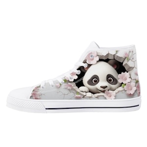 May include: White high-top canvas shoes featuring a graphic of a panda bear peeking out of a cracked wall with pink flowers.