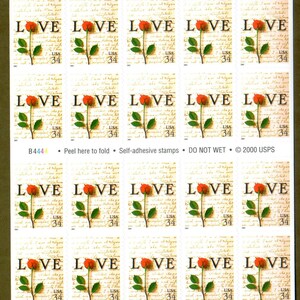 May include: A sheet of twenty 34-cent US postage stamps featuring a red rose with the word "LOVE" printed on each stamp. The stamps are self-adhesive and have the text "DO NOT WET" printed at the bottom.