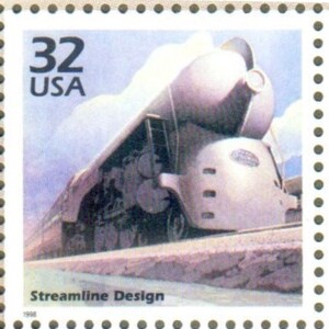 May include: A vintage US postage stamp featuring a silver streamlined train with the text "32 USA" and "Streamline Design".