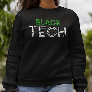 May include: Black sweatshirt with the text "BLACK TECH" in white and green outlined letters.