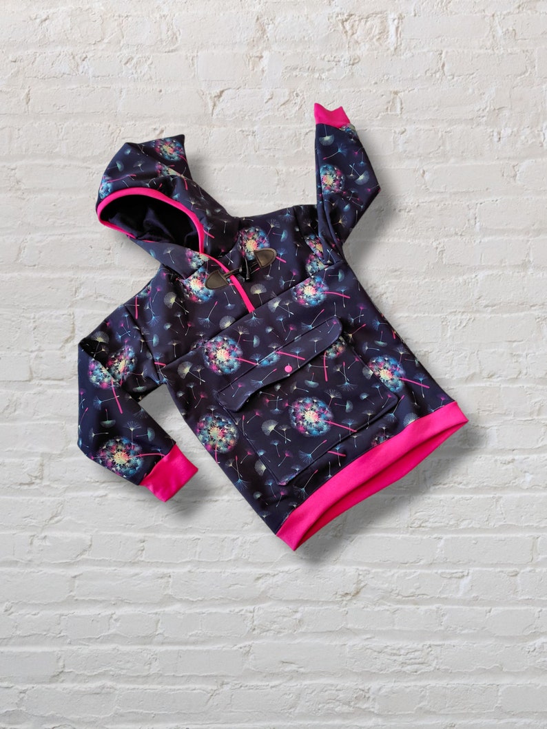 May include: A black hooded sweatshirt with a pink trim and a dandelion print. The sweatshirt has a kangaroo pocket and a zipper closure.