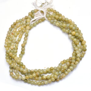 Lite Green Cat&#39;s Eye Gemstone Beads: 5-6mm Smooth Round Strand