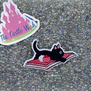 Playful Black Cat on Wrapping Paper Vinyl Sticker