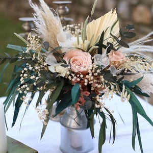 Vase flower arrangement with preserved blush roses, pampas grass, eucalyptus, and dried greenery. Rustic boho wedding table decor handmade by GulFloraWedding, perfect for centerpieces or gifts.