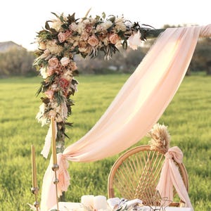 Wedding arch floral arrangement handmade with preserved salmon roses, pampas grass and eucalyptus. Two 25”x14” arch flowers by GulFloraWedding, perfect for boho rustic outdoor wedding ceremony decor and photography styling.