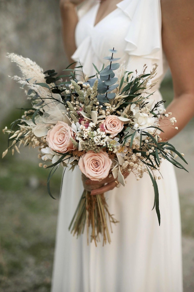 Boho rustic bridal bouquet with preserved salmon roses, eucalyptus, dried grasses and cream gypsophila. Medium free-form bouquet handmade by GulFloraWedding for timeless romantic weddings