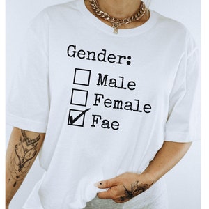 May include: White t-shirt with a black graphic that says "Gender:" with a checkbox next to each option: "Male", "Female", and "Fae". The "Fae" checkbox is checked.