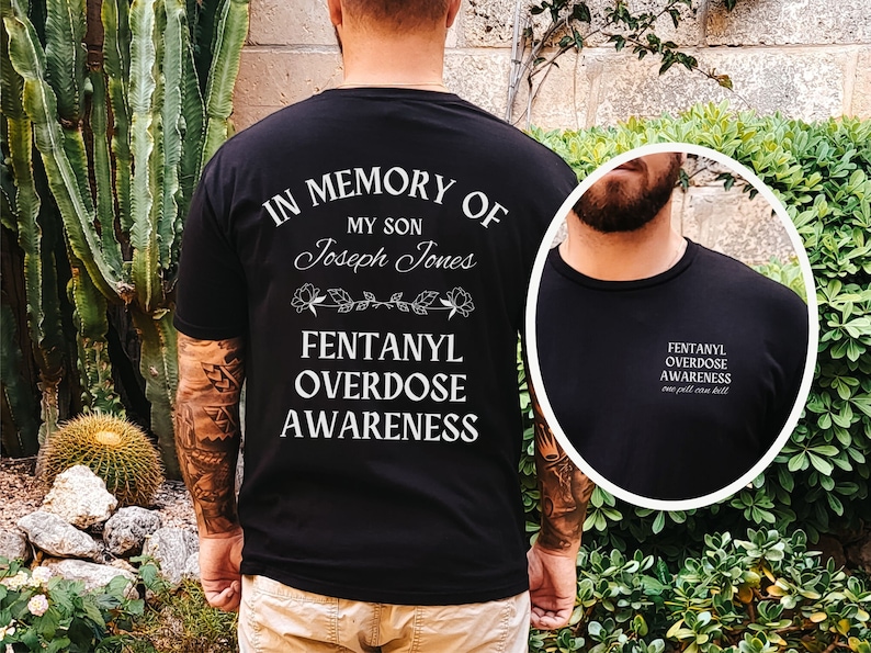 May include: Black t-shirt with white text that reads "In Memory of My Son Joseph Jones Fentanyl Overdose Awareness".