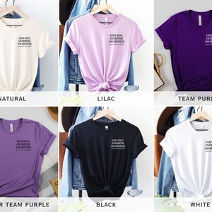 May include: Six different color t-shirts with the text "FENTANYL OVERDOSE AWARENESS" printed on the front. The colors are natural, lilac, team purple, heather team purple, black, and white.