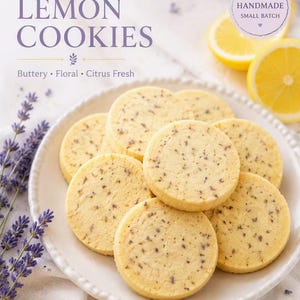 May include: A stack of round, pale yellow cookies speckled with dried lavender buds on a white scalloped plate. The text reads LAVENDER LEMON COOKIES, Buttery, Floral, Citrus Fresh, and a circular label says HANDMADE SMALL BATCH.