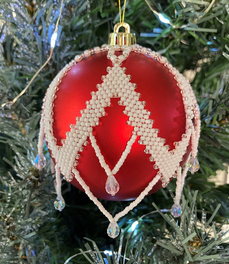 Tutorial pattern for seed bead Christmas ornament cover with peyote stitch.  Herringbone pattern with teardrop dangle crystals.