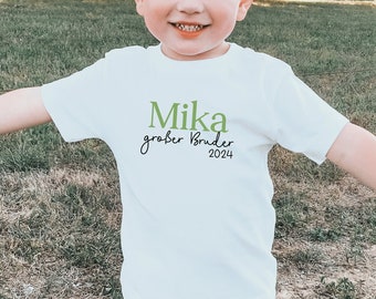 weißes T-Shirt oder Baby Body "Großer Bruder 2024" oder Wunschtext I personalisiert mit Namen I Verkündung zweites Kind