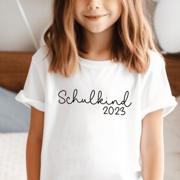 White T-shirt “Schulkind 2023” printed in desired color I, personalized with name if desired. Gift for starting school