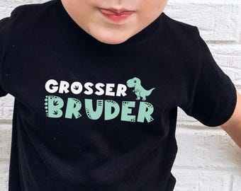 Dino T-Shirt "großer Bruder" in schwarz – personalisierbar mit Wunschtext, Name & Jahr I Schwangerschaftsverkündung I Geschenk