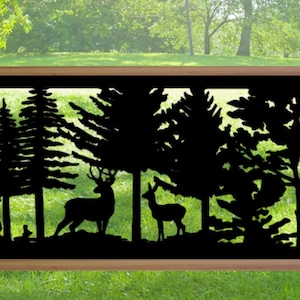 May include: A decorative black metal fence panel featuring a forest scene with deer, trees, and a fox silhouette. The panel is framed by a natural wood border, perfect for outdoor decor. The scene is set against a backdrop of green foliage.