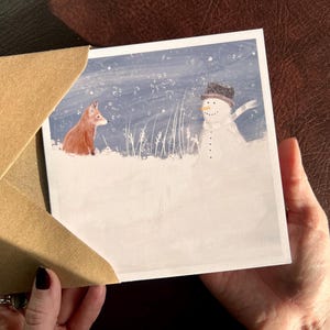 Carte de Noël renard et bonhomme de neige pour grand-mère grand-père maman papa petite-fille petit-fils avec scène de neige en hiver photo par un artiste du Yorkshire