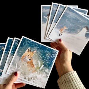 Paquet multiple de cartes de Noël avec 8 dessins d'animaux différents, y compris des dessins de renard, de hibou et de lapin dans des scènes de neige hivernales nocturnes