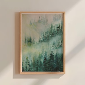 May include: A framed watercolor painting of a misty forest scene with green trees and a light blue sky. The painting is in a light wood frame.