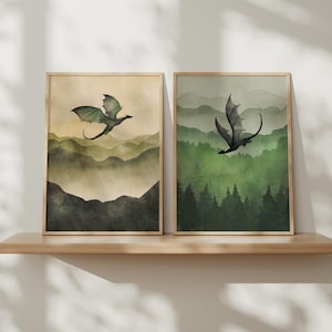 Könnte beinhalten: Ein Set aus drei Keramikbechern mit gesprenkelter, matter Oberfläche. Die Becher sind in Creme-, Hellgrau- und Dunkelgrautönen gehalten. Jeder Becher hat ein schlichtes, minimalistisches Design und einen abgerundeten Henkel.