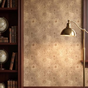 May include: Wallpaper featuring a vintage map pattern in shades of tan and brown, displayed on a wall next to a dark wood bookshelf filled with globes and books, and illuminated by a brass floor lamp with a dome-shaped shade.
